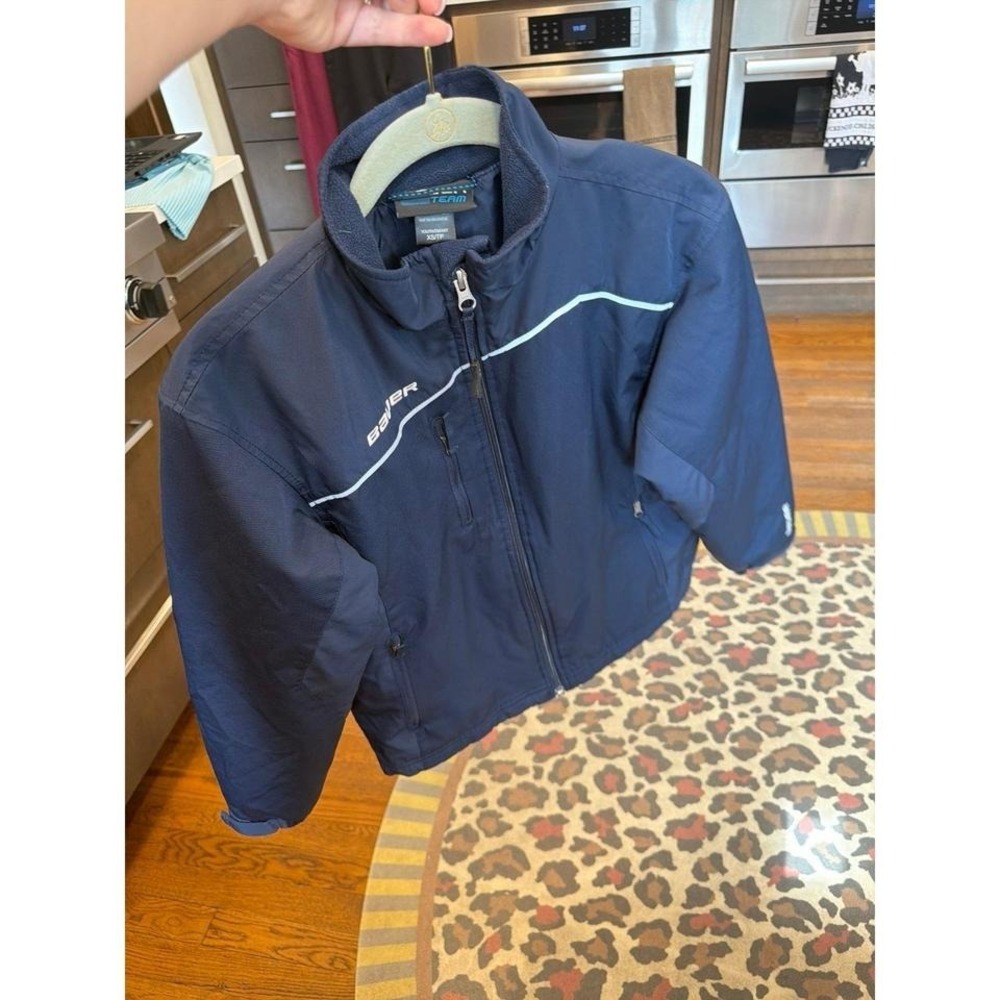 Bauer Team youth warm-up jacket features white piping and a zippered fleece XS